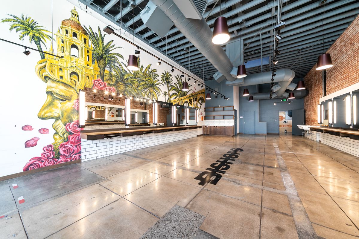 Suite 1 interior: the mural wall near the storefront glass.