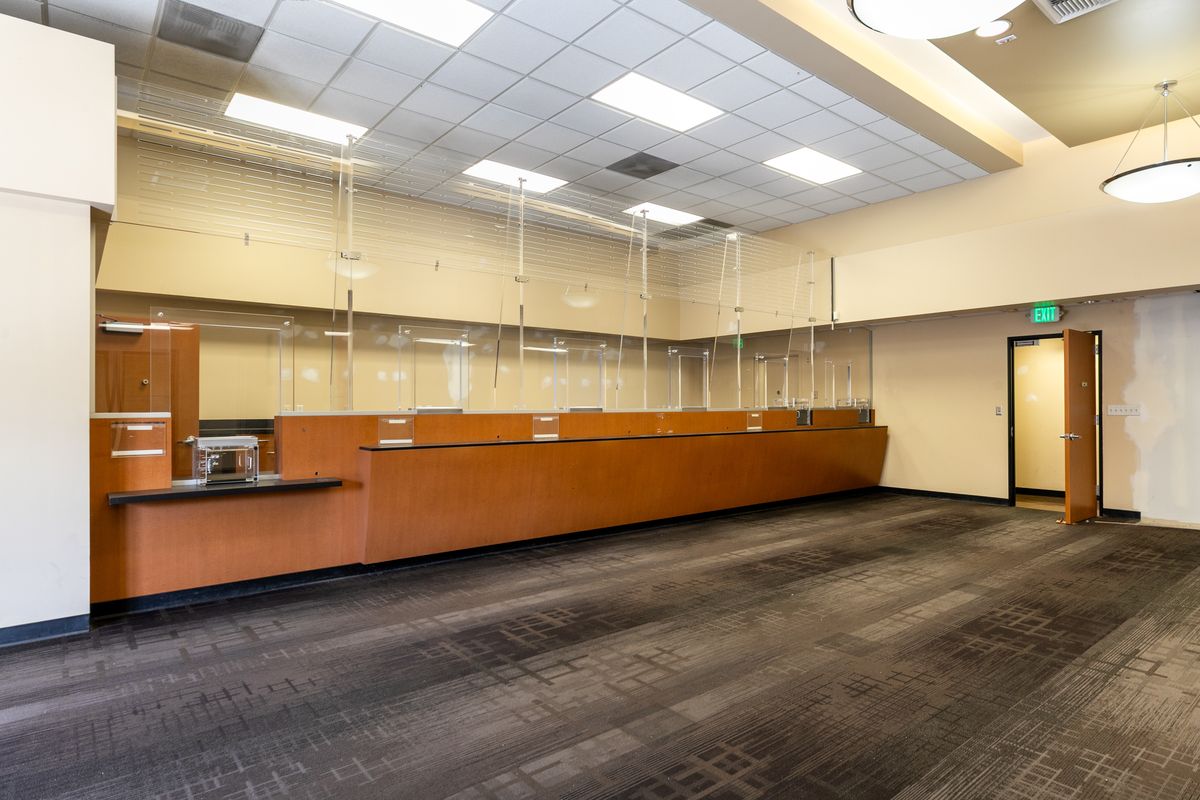 Suite 2 interior: the former teller counter under a dropped ceiling.