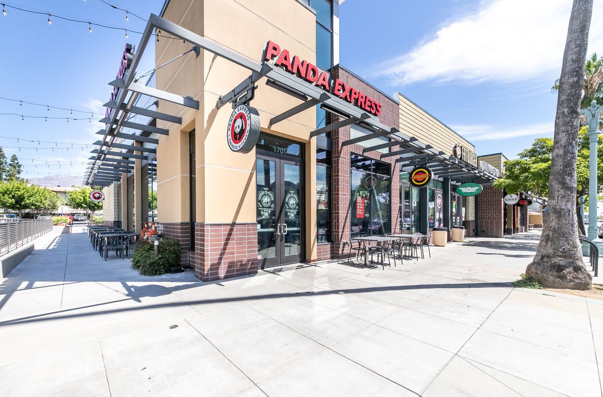The Panda Express entrance at 1701 E Colorado Blvd with outdoor tables under string lights.